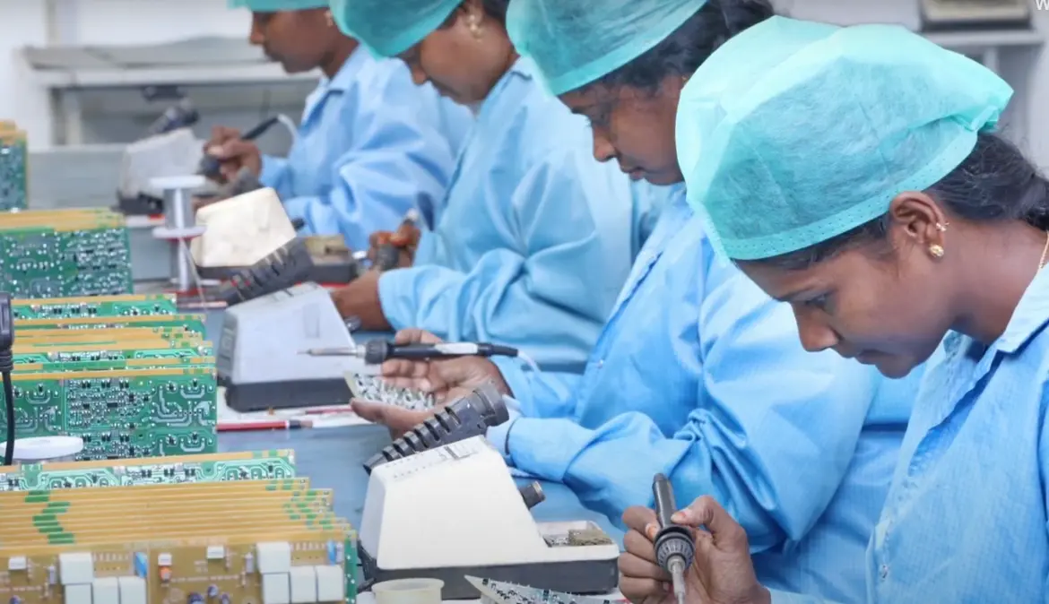 Female technicians at Sanjay Technologies performing precision soldering on PCB assemblies in an advanced electronics manufacturing facility.